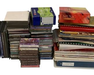 725 - Assorted Books, CDs, Cassettes & DVDs (Description): A mixed lot of books, CDs, cassettes, and  DVDs. The assortment includes various titles  and media formats suitable for entertainment  and reference purposes.