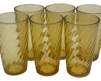 463 - 6  Amber Glasses 5.25"x3" (Description): A set of six amber glasses featuring a  swirled pattern. Each glass measures 5.25  inches tall by 3 inches in diameter.
