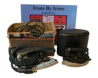 193 - Vintage Irons w/ Book (Description): A lot of vintage irons accompanied by a  reference book. The collection includes  multiple antique pressing irons along with  related literature for collectors and  enthusiasts. Used as is electric/electronic/mechanical  item. No guarantee all components, untested.