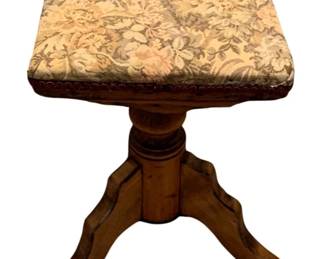 681 - Stool 19"x12"x12" (Description): A stool featuring an upholstered seat with  floral fabric and nailhead trim detail. The  piece has a turned wooden pedestal base with  four curved legs. Measures 19 inches in  height by 12 inches by 12 inches.