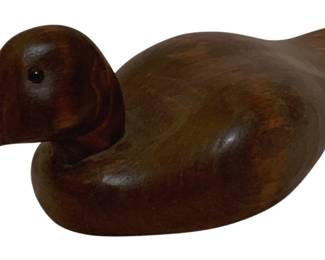 746 - Wood Duck Decoy 4.5"x11"x5" (Description): Wood duck decoy with a smooth, carved finish  and glass eye detail. Measures 4.5 inches  high by 11 inches long by 5 inches wide.