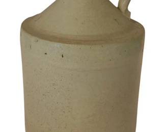 210 - Stoneware Jug 8"x6" (Description): Stoneware jug with traditional handle and  spout design. Measures 8 inches tall by 6  inches in diameter.