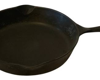 241 - Cast Iron Skillet 10.5" Round (Description): Cast iron skillet measuring 10.5 inches  round. Features a classic design with a pour  spout and hanging hole on the handle.
