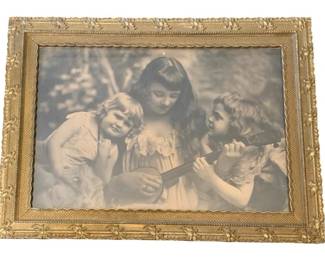 170 - Framed Print 22"x29" (Description): A framed print measuring 22 inches by 29  inches. The print is presented in an ornate  gilded frame with decorative floral corner  accents and a scalloped inner border.