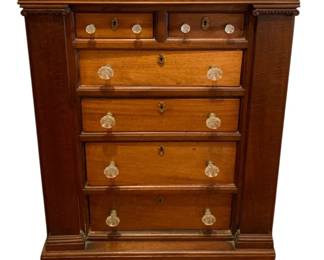 621 - Antique 6-Drawer Chest 39"x24"x13" (Description): Antique six-drawer chest featuring two small  upper drawers over four graduated full-width  drawers. The piece is fitted with decorative  glass knobs and brass keyhole escutcheons.  Flanking column details and carved accents add period character. Measures 39 inches high  by 24 inches wide by 13 inches deep.