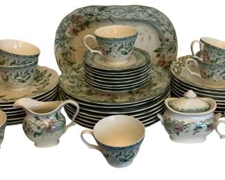 466 - 43pcs Westbury Court Fine China (Description): A 43-piece set of Westport Court china. The  set features a coordinated floral pattern  with green foliate motifs on a cream ground.  Pieces include dinner plates, salad plates,  bread plates, cups, saucers, a creamer, a covered sugar bowl, and a serving platter.