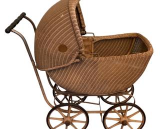 133 - Antique Wicker Baby Carriage 36"x34"x77" (Description): Antique wicker baby carriage featuring a  traditional pram design with a curved hood  canopy. The carriage is constructed with  woven wicker on a metal frame, with spoked  wheels and a black handle grip. Measures 36 inches wide by 34 inches deep by 77 inches in  height.