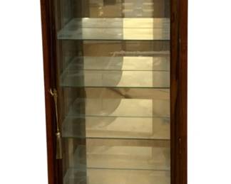 674 - Curio Cabinet 73"x28"x14" (Description): Curio cabinet featuring glass shelving and a  locking door with key. Measures 73 inches  tall by 28 inches wide by 14 inches deep.
