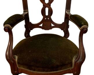 682 - Antique Chair 40"x28"x22" (Description): Antique chair featuring carved wood frame  with decorative back splat and upholstered  seat and armrests. Measures 40 inches high by  28 inches wide by 22 inches deep.