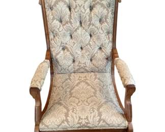 66 - Antique Rocker 41"x24"x23" (Description): Antique rocker featuring a carved wooden  frame with tufted upholstered back and damask  fabric. Measures 41 inches high by 24 inches  wide by 23 inches deep.