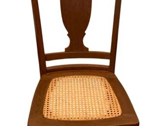 688 - Antique Rocker 34"x16"x27" (Description): Antique rocker featuring a cane seat and  classic splat back design. Measures 34 inches  high by 16 inches wide by 27 inches deep.