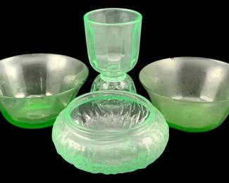 393 - 4 Uranium Green Glass Items (Description): A four-piece lot of uranium glass items. The  collection includes various pieces showcasing  the characteristic green glow of uranium  glass - some chips