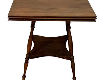 683 - Wood Parlor Table 23.5"x23.5"x24.5" (Description): Wood table featuring turned legs with a lower  shelf and decorative ball and claw feet.  Measures 23.5 inches by 23.5 inches by 24.5  inches.