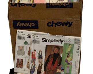 727 - Assorted Vintage Sewing Patterns (Description): A lot of vintage sewing patterns. The  collection includes various patterns from  brands such as Simplicity and McCall's,  featuring designs for women's clothing  including vests, dresses, slips, and other garments.