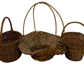755 - Assorted Baskets (Description): A collection of three woven baskets, each  featuring a handle. The lot includes baskets  of varying sizes and weave patterns.