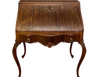 766 - Antique Slant-Front Desk 43"x33"x19" (Description): Antique slant-front desk featuring elegant  carved detailing on the fall front panel, a  serpentine-shaped drawer with brass drop  pulls, and graceful cabriole legs. The desk  measures 43 inches high by 33 inches wide by 19 inches deep.