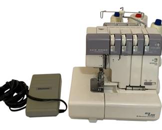 793 - New Home Sewing Machine 13"x10"x11" (Description): New Home sewing machine. This electronic  controlled MyLock serger features  differential feed capability. Measures 13" x  10" x 11". Includes foot pedal. Used as is electric/electronic/mechanical item. No guarantee all components, untested.