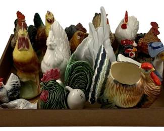 499 - Assorted Bird Figures (Description): A lot of assorted bird figures featuring  various ceramic and porcelain roosters, hens,  and chickens in an array of colors and  styles. The collection includes decorative  figurines and functional pieces such as a planter or creamer.
