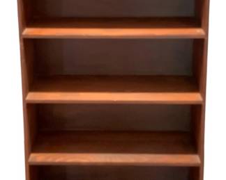 679 - Wood Bookcase 48"x34.5"x8" (Description): A wood bookcase featuring four shelves for  storage and display. Measures 48 inches tall  by 34.5 inches wide by 8 inches deep.