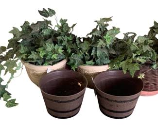 3 - Assorted Planters (Description): A set of two cast iron planters in a classic  campana urn form. Each planter features  decorative detailing and rests on a square  pedestal base. Measurements are 24 inches  tall by 19 inches in diameter.