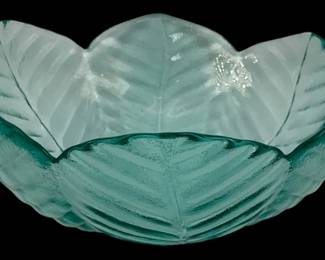 335 - Blue Glass Bowl 3.25"x7.5" (Description): Blue glass bowl with a decorative leaf-shaped  design. Measures 3 1/4 inches tall by 7.5  inches in diameter.