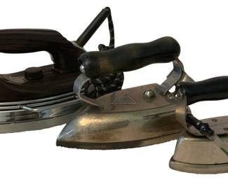 185 - 3 Vintage Irons (Description): A lot of three vintage irons. The collection  showcases different styles and eras of iron  design, representing the evolution of this  essential household tool.