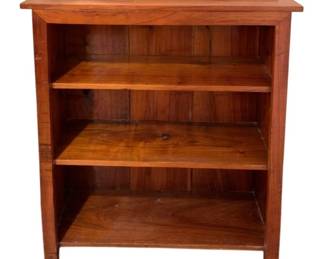 622 - Wood Bookshelf 41"x32"x9.25" (Description): A wooden bookshelf featuring three fixed  shelves and a low gallery back. The piece  displays warm wood tones with visible natural  grain throughout. Measures 41 inches tall by  32 inches wide by 9.25 inches deep.