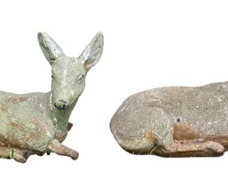 16 - 2 Concrete Deer 13"x15"x8" (Description): A pair of concrete deer sculptures in  recumbent poses. The figures display  weathered patina consistent with outdoor  garden use. Measurements: 13" x 15" x 8".