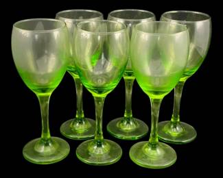 411 - 6 Green Glass Wine Glasses 7.5"x3.25" (Description): A set of six green glass wine glasses. Each  glass measures 7 1/2 inches in diameter by  3.25 inches in height.