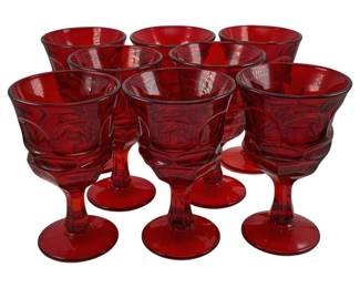 522 - 8 Vintage Ruby Red Goblets 6.25"x4" (Description): A set of eight red glass goblets featuring a  decorative pressed pattern. Each glass  measures 6 1/4 inches tall by 4 inches in  diameter.