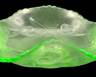 342 - Uranium Green Glass Dish 2.25"x6.5"x5.5" (Description): Uranium glass dish with decorative handles  and scalloped edges. Measures 2 1/4" x 6 1/2"  x 5.5".