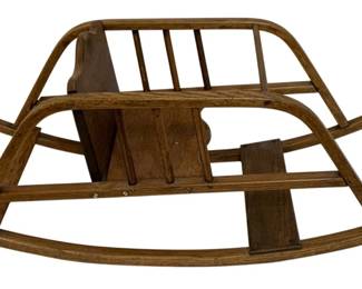 732 - Antique Wood Rocker 13"x33"x14" (Description): Antique wood rocker featuring a bentwood  frame construction with spindle details and a  slatted seat. This piece shows traditional  craftsmanship with curved rocker rails and an  open back design. Measures 13 inches by 33 inches by 14 inches.