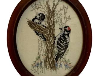 736 - Framed Needlepoint 12"x9.5" (Description): Needlepoint artwork displayed in an oval  wooden frame. Measures 12 inches by 9.5  inches.