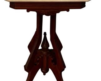 703 - Marble-Top Table 28.5"x20"x15" (Description): Marble-top table featuring a carved wooden  base with decorative finial detail and four  splayed legs. The table measures 28.5 inches  in height, 20 inches in width, and 15 inches  in depth.