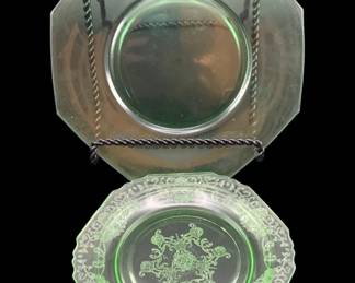 536 - 2 Uranium Green Glass Plates 6", 7.5" (Description): A two-piece lot of uranium glass plates. The  collection includes two octagonal plates in  green uranium glass, measuring 6 inches and  7.5 inches respectively.