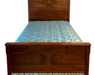 712 - Antique Full Size Bed w/ Bedding 80"x57.5"x80" (Description): Antique full size bed with bedding included.  The bed features a carved wooden headboard  and footboard with decorative burl wood  veneer panels. Measures 80 inches wide by  80.5 inches deep by 57 inches tall.