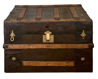 609 - Antique Flat-Top Trunk w/ tray (Description): Antique flat-top trunk featuring wood slat  construction with brass hardware and  decorative metal accents. 22"x32"x18.5"