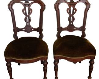 160 - 2 Antique Chairs 37"x19"x17" (Description): A set of two antique chairs featuring ornate  carved wooden backs with a decorative  interlocking splat design. The chairs are  supported by turned legs and feature  upholstered seats. Each chair measures 37 inches high by 19 inches wide by 17 inches  deep.