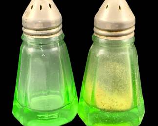 412 - Uranium Green Glass Salt & Pepper Shakers (Description): A 2-piece set of uranium glass salt and  pepper shakers. Each shaker measures 3 inches  tall.