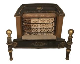 116 - Gas Heater 22"x24"x10" (Description): Antique gas heater featuring ornate  decorative details with brass finial accents  on the fender legs. The unit displays ceramic  radiant tiles behind a protective grate and  includes decorative molding along the hood. Measures 22 inches wide by 24 inches tall by  10 inches deep.