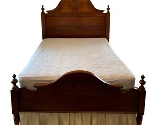 617 - Antique Full Size Bed Frame w/ Bedding (Description): Antique full size bed with bedding included.  Features ornate carved headboard with central  crest and finials, matching footboard with  decorative detailing and turned posts. 72h x  58w x 85L