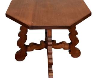 110 - Wood Table 30"x36"x36" (Description): A wood table featuring an octagonal top  supported by decorative scrolled legs  connected by a curved stretcher base.  Measures 30 inches tall by 36 inches by 36  inches.