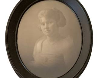 81 - Framed Print 11"x8" (Description): A framed print measuring 11 inches by 8  inches. The print is presented in an oval  frame with a dark finish.