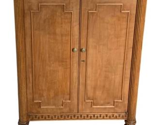 32 - Antique Bar Cabinet 35"x21"x13.5" (Description): Antique bar cabinet featuring classic styling  with paneled double doors, decorative Greek  key molding, fluted column details, and  turned legs. Measures 35 inches tall by 21  inches wide by 13.5 inches deep.