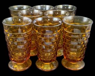 355 - 8 Amber Glass "Cubist" Glasses 6"x3.5" (Description): A set of amber glass "Cubist" glasses  featuring a distinctive geometric block  pattern. Each footed glass measures 6 inches  tall by 3.5 inches in diameter.