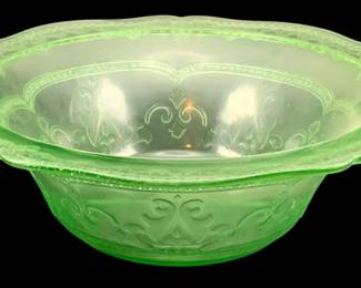 329 - Uranium Green Glass Bowl 3"x9" (Description): Uranium glass bowl featuring a decorative  pressed pattern with scrollwork designs. The  bowl has a scalloped rim edge. Measures 3  inches tall by 9 inches in diameter.