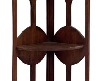717 - Corner Shelf Curved 23"x8.5"x5.5" (Description): Curved corner shelf crafted from wood with a  warm finish. Features three tiers with  decorative cutout side panels and a scalloped  top. Measures 23 inches tall by 8.5 inches  wide by 5.5 inches deep.