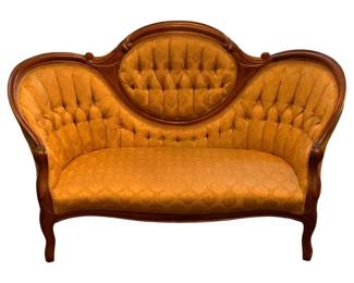 76 - Antique Victorian Settee 36.5"x58"x28" (Description): Antique settee featuring elegant  Victorian-style design with tufted upholstery  and carved wooden frame. Measures 36.5  inches high by 58 inches wide by 28 inches  deep.