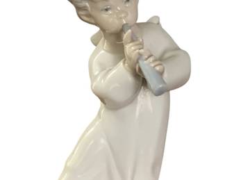 51 - Lladro Angel with Flute Porcelain Figure 6.5" tall (Description): Lladro porcelain statue depicting a young  angel playing bagpipes. The figurine measures  6.5 inches tall and features the  characteristic soft pastel coloring and fine  detailing associated with Lladro craftsmanship.