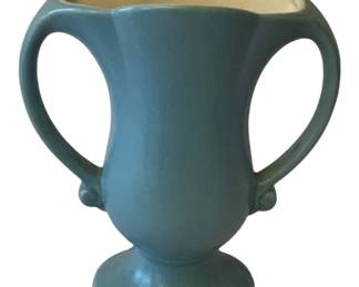 88 - Red Wing Pottery Vase 8.5"x7"x3.5" (Description): Red Wing Pottery vase featuring a classic  two-handled urn form with a scalloped rim and  pedestal base. The exterior is finished in a  matte blue-green glaze with a cream-colored  interior. Measures 8.5 inches tall by 7 inches wide by 3.5 inches deep.